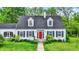 Classic home showcasing a red front door and dormer windows at 8301 E County Road 801 S, Plainfield, IN 46168