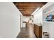 Hallway showing wood-look flooring, white walls, and natural light at 8301 E County Road 801 S, Plainfield, IN 46168
