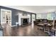 Comfortable living room with wood floors, a fireplace, and an open layout at 8301 E County Road 801 S, Plainfield, IN 46168