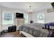 Bright main bedroom with multiple windows and a vintage chandelier at 8301 E County Road 801 S, Plainfield, IN 46168