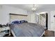 Spacious main bedroom with vintage chandelier and ample natural light at 8301 E County Road 801 S, Plainfield, IN 46168