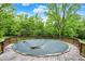 Backyard view of the covered pool with wooden decking at 8301 E County Road 801 S, Plainfield, IN 46168
