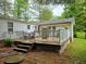 The back of the house features a deck and a yard at 8310 Dog Trot Ln, Morgantown, IN 46160