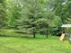 Backyard with trees and a playground at 8310 Dog Trot Ln, Morgantown, IN 46160