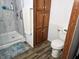Bathroom featuring walk-in shower with glass door and additional storage at 8310 Dog Trot Ln, Morgantown, IN 46160