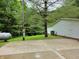 Home exterior with a visible propane tank, air conditioner, and concrete patio at 8310 Dog Trot Ln, Morgantown, IN 46160