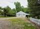 Spacious detached garage with two bays and decorative bunting adding charm to the property at 8310 Dog Trot Ln, Morgantown, IN 46160