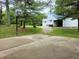 Basketball hoop and metal detached garage in the backyard at 8310 Dog Trot Ln, Morgantown, IN 46160