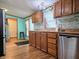 Bright kitchen featuring tiled backsplash, wood countertops, and stainless dishwasher at 8310 Dog Trot Ln, Morgantown, IN 46160