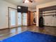 Bright living room with closet space, TV, and wood-look vinyl floors at 8310 Dog Trot Ln, Morgantown, IN 46160