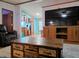 View of open living area with large TV and wood furnishings at 8310 Dog Trot Ln, Morgantown, IN 46160