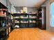 Pantry with shelving and ample storage, featuring wood-look floors at 8310 Dog Trot Ln, Morgantown, IN 46160