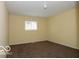 Cozy bedroom with neutral walls, carpet, and a large window providing natural light at 8361 Paso Del Norte Ct, Indianapolis, IN 46227