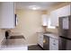 Modern kitchen with white cabinets, stainless steel appliances, and granite countertops at 8361 Paso Del Norte Ct, Indianapolis, IN 46227