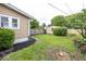 Cozy backyard featuring a detached garage and a well-maintained lawn at 839 N Oxford St, Indianapolis, IN 46201
