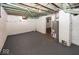 Unfinished basement, providing ample storage space, with painted walls and ceiling at 839 N Oxford St, Indianapolis, IN 46201