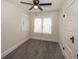 Cozy bedroom with neutral paint, carpet, ceiling fan and plenty of natural light at 839 N Oxford St, Indianapolis, IN 46201