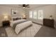 Cozy bedroom with a ceiling fan, neutral tones, and a decorative rug at 839 N Oxford St, Indianapolis, IN 46201