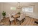 Inviting dining room boasts a modern chandelier, ample natural light, and seating for six at 839 N Oxford St, Indianapolis, IN 46201