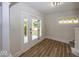 Bright entryway with new flooring, decorative window, and stylish door at 839 N Oxford St, Indianapolis, IN 46201