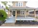 Inviting front porch with stylish railings, steps, and fresh landscaping, perfect for relaxing outdoors at 839 N Oxford St, Indianapolis, IN 46201