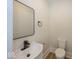A compact half-bath featuring sleek fixtures, contemporary accents and stylish tiling at 839 N Oxford St, Indianapolis, IN 46201