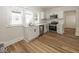 Modern kitchen with stainless steel appliances, white cabinets, and hardwood floors at 839 N Oxford St, Indianapolis, IN 46201