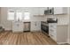 Charming kitchen featuring stainless steel appliances, quartz countertops, and modern cabinetry at 839 N Oxford St, Indianapolis, IN 46201