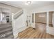 Open living space with staircase, light hardwood floors and updated finishes at 839 N Oxford St, Indianapolis, IN 46201