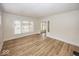 Bright living room featuring wood floors, a large window, and neutral paint at 839 N Oxford St, Indianapolis, IN 46201