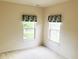 Bedroom with natural lighting from two windows and neutral carpet at 855 Gazebo Way # C, Greenwood, IN 46142
