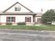 Charming home featuring classic architecture, well-kept lawn, and red shutters at 855 Gazebo Way # C, Greenwood, IN 46142