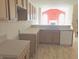 Kitchen with laminate countertops and white appliances at 855 Gazebo Way # C, Greenwood, IN 46142