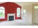 Bright living room featuring a fireplace, large windows, and neutral carpet at 855 Gazebo Way # C, Greenwood, IN 46142