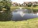 Scenic pond with a fountain and well manicured landscaping at 855 Gazebo Way # C, Greenwood, IN 46142