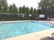 Beautiful swimming pool with clear blue water and plenty of space for swimming at 855 Gazebo Way # C, Greenwood, IN 46142