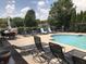 Resort-style pool with lounge chairs for relaxing by the water at 855 Gazebo Way # C, Greenwood, IN 46142
