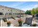 Charming balcony with patio furniture overlooking a townhome community at 9090 Demarest Dr, Fishers, IN 46038
