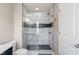 Modern bathroom showcasing a glass-enclosed shower with stylish tile work and convenient built-in shelves at 9090 Demarest Dr, Fishers, IN 46038