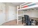 Bedroom featuring a lofted bed with a built-in desk area, creating a functional and modern space at 9090 Demarest Dr, Fishers, IN 46038