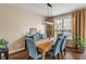 Inviting dining room featuring stylish seating, a modern chandelier, and a serene ambiance at 9090 Demarest Dr, Fishers, IN 46038