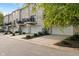 Exterior view of townhomes with attached garages and landscaped grounds at 9090 Demarest Dr, Fishers, IN 46038