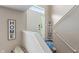Inviting foyer with white door, a welcome sign, and a glimpse of the staircase at 9090 Demarest Dr, Fishers, IN 46038