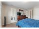 Comfortable main bedroom featuring a dresser and connecting bathroom for added privacy and convenience at 9090 Demarest Dr, Fishers, IN 46038