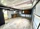Unfinished basement with exposed ceiling and concrete floor presenting potential for customization at 910 Lonsvale Dr, Anderson, IN 46013