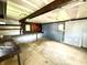 Unfinished basement with dark painted walls, concrete floor, offering potential for customization at 910 Lonsvale Dr, Anderson, IN 46013