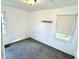 Bedroom with a window and neutral carpet flooring providing a simple and functional space at 910 Lonsvale Dr, Anderson, IN 46013