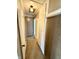 Hallway with carpet, a light fixture, and white storage cabinets at 910 Lonsvale Dr, Anderson, IN 46013