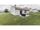 A backyard with a well-maintained lawn and a small patio, perfect for outdoor enjoyment at 933 Curlew Ln, Greenwood, IN 46143