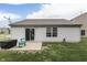 Backyard view featuring a well-maintained lawn, and a concrete patio at 933 Curlew Ln, Greenwood, IN 46143